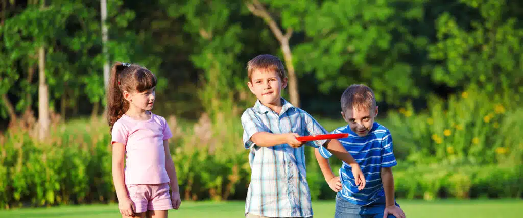 playing frisbee in the yard