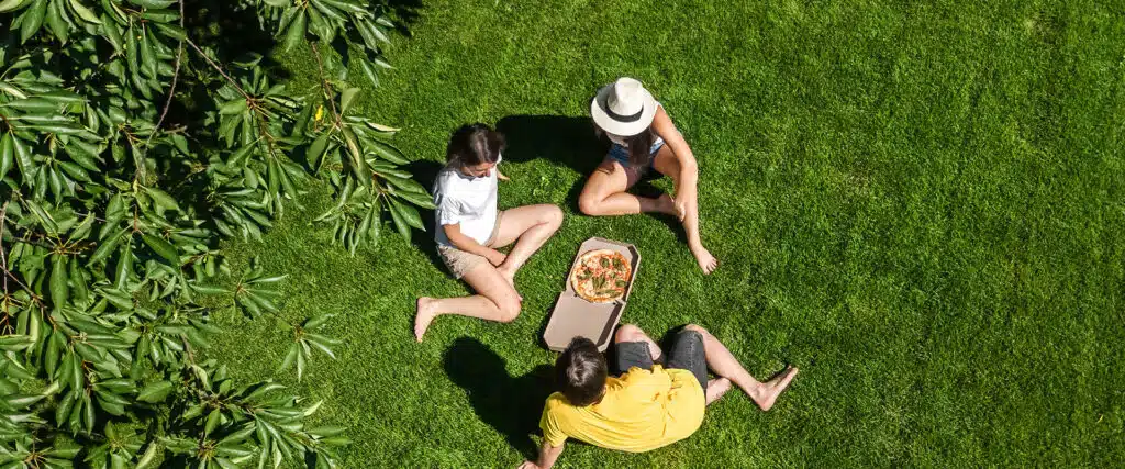 family sitting on lawn