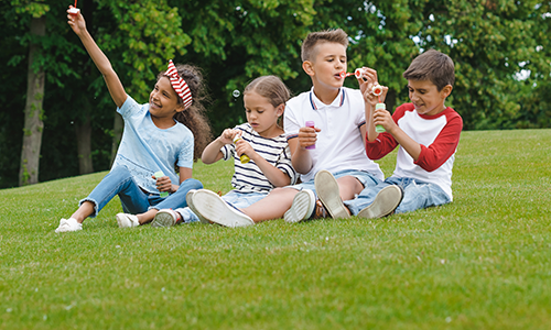 kids enjoying a profession lawn